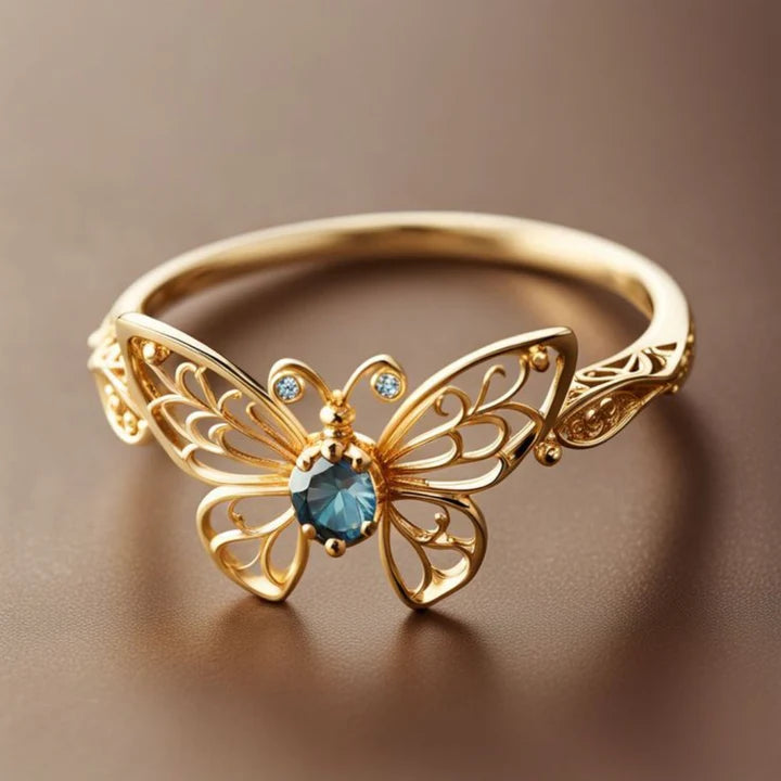 Anillo Exótico Cristal Azul Mariposa en Oro