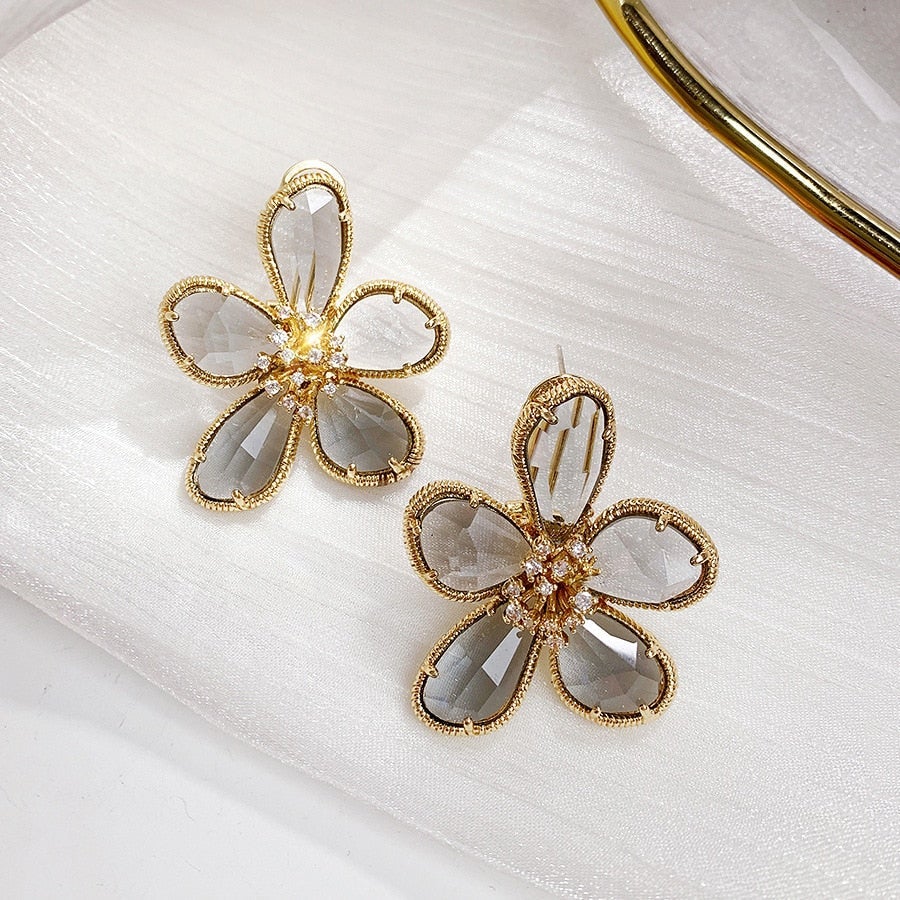 Pendientes Rotativos Flor de la Riqueza con Circonitas Incrustadas